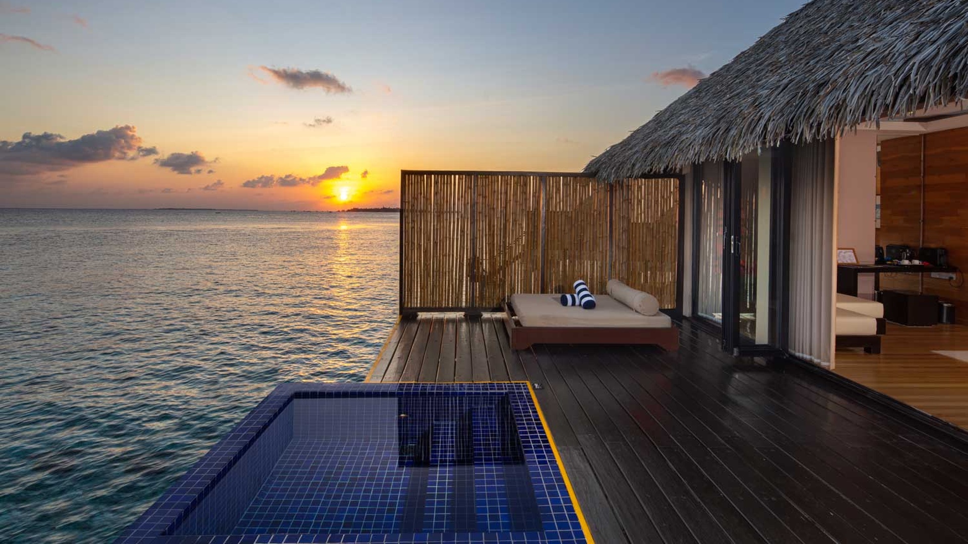 Adaaran Prestige Vadoo pool sunset view